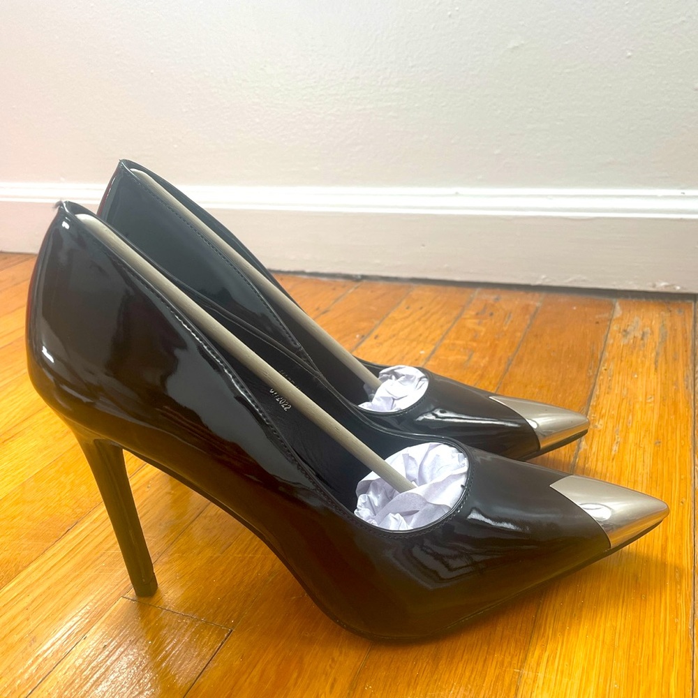 A black patent heel from Pretty Little Thing size 7 never worn